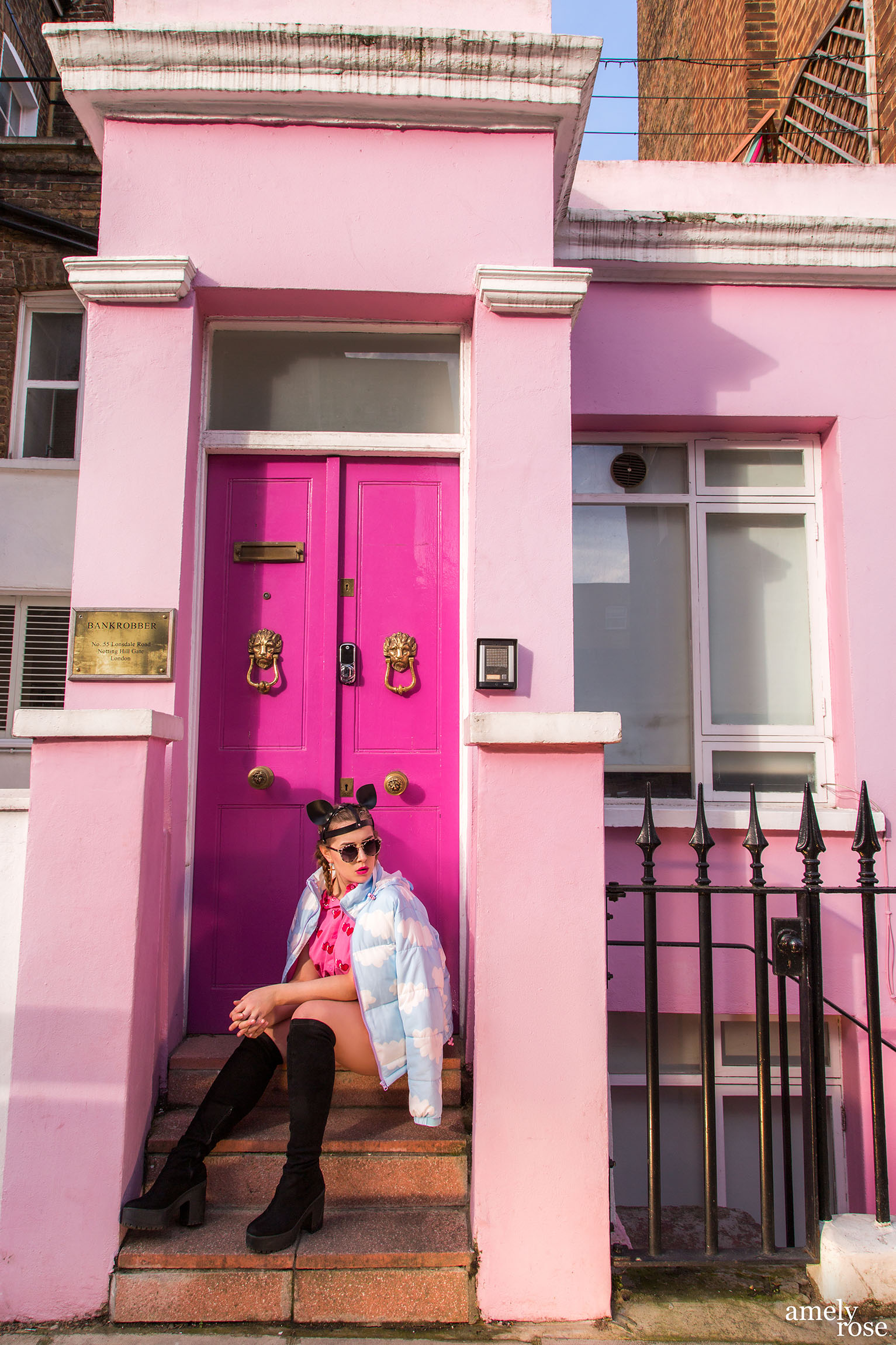 pink Barbie house and Amely Rose wearing a cloud jacket