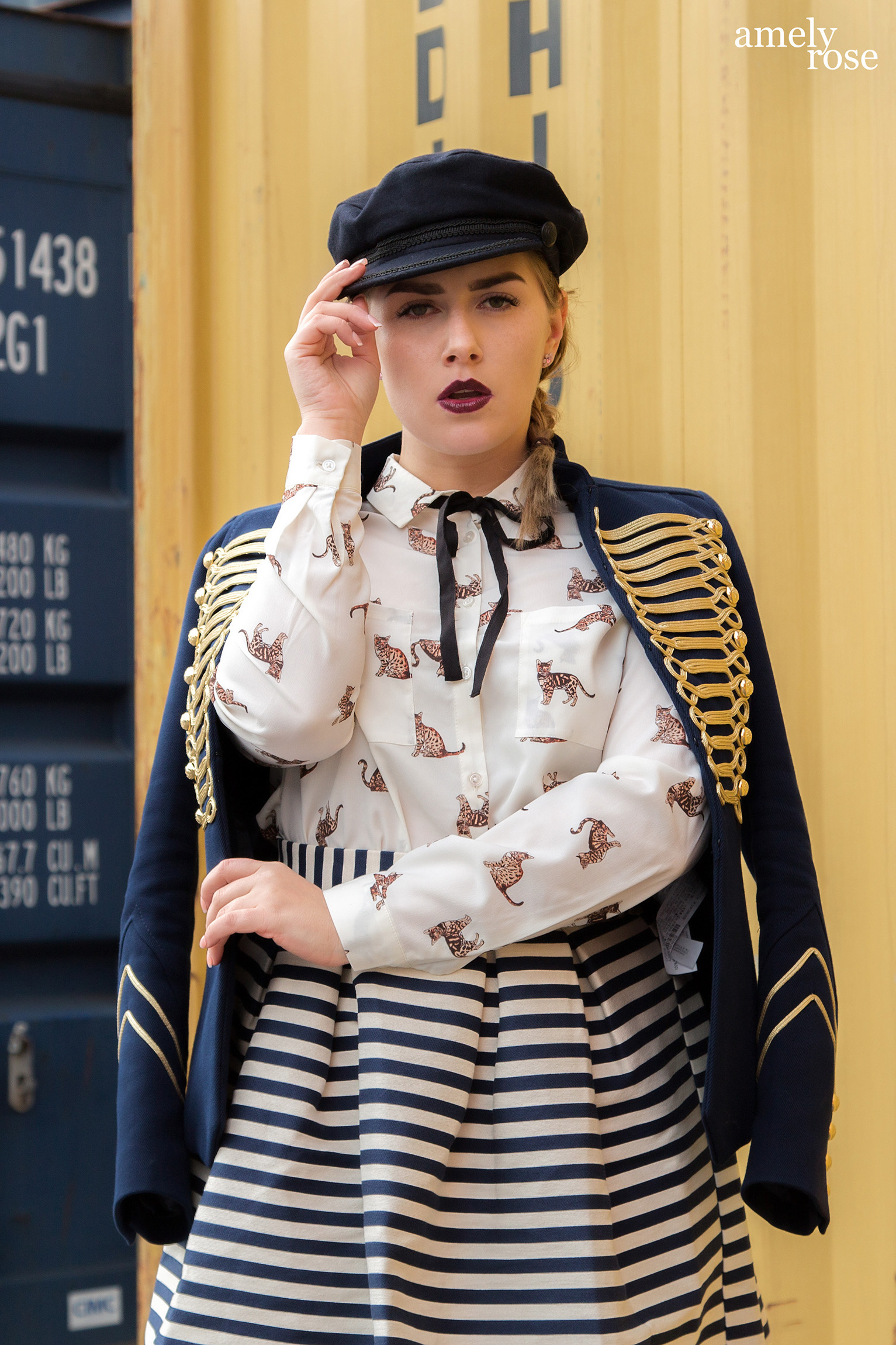 amely rose a german fashion blogger wearing a marine uniform as a summerlook with a catprint blouse and hat